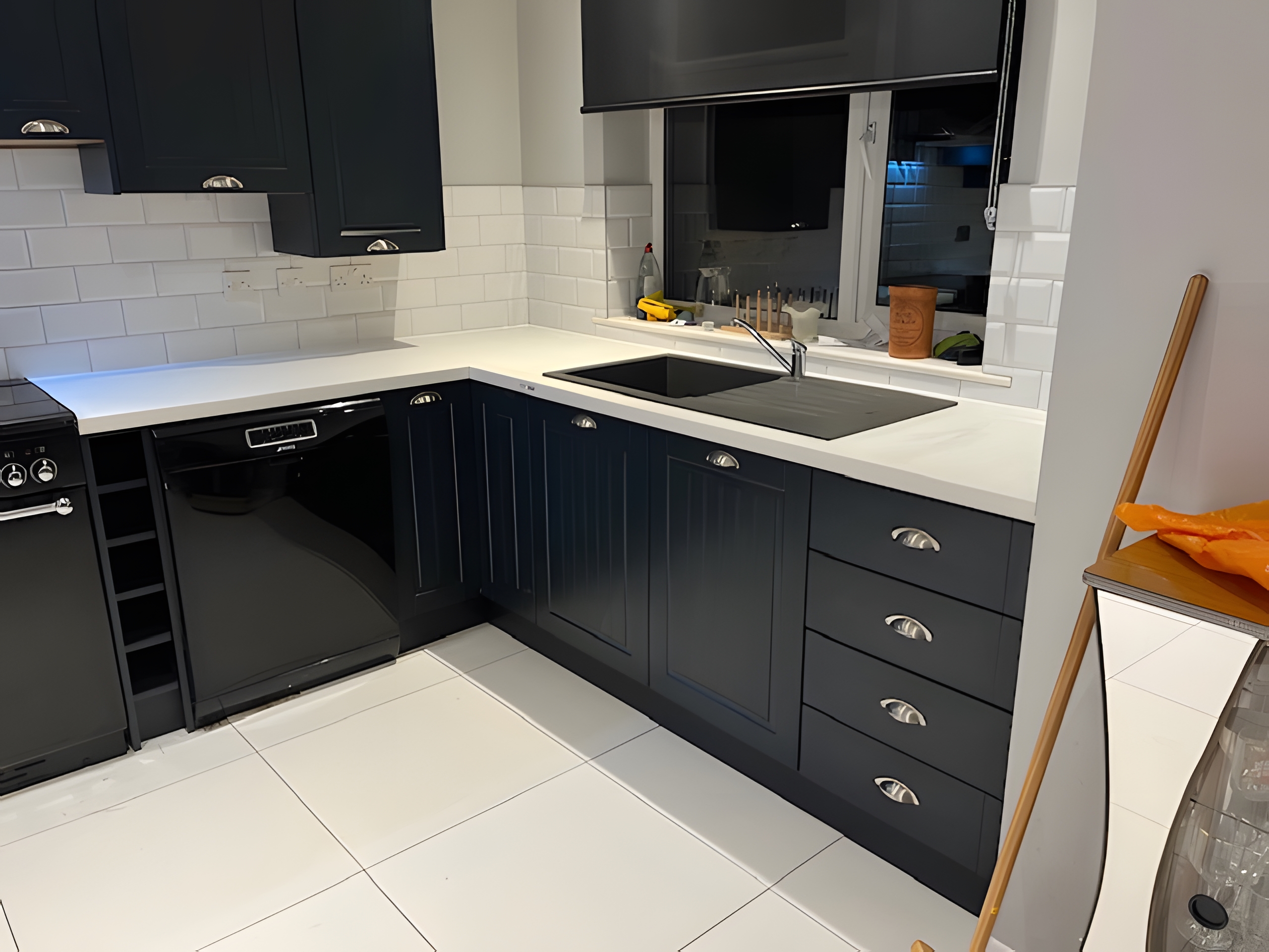 Modern kitchen with Taunton Graphite Matt doors and Bianco Riso Quartz worktops after transformation