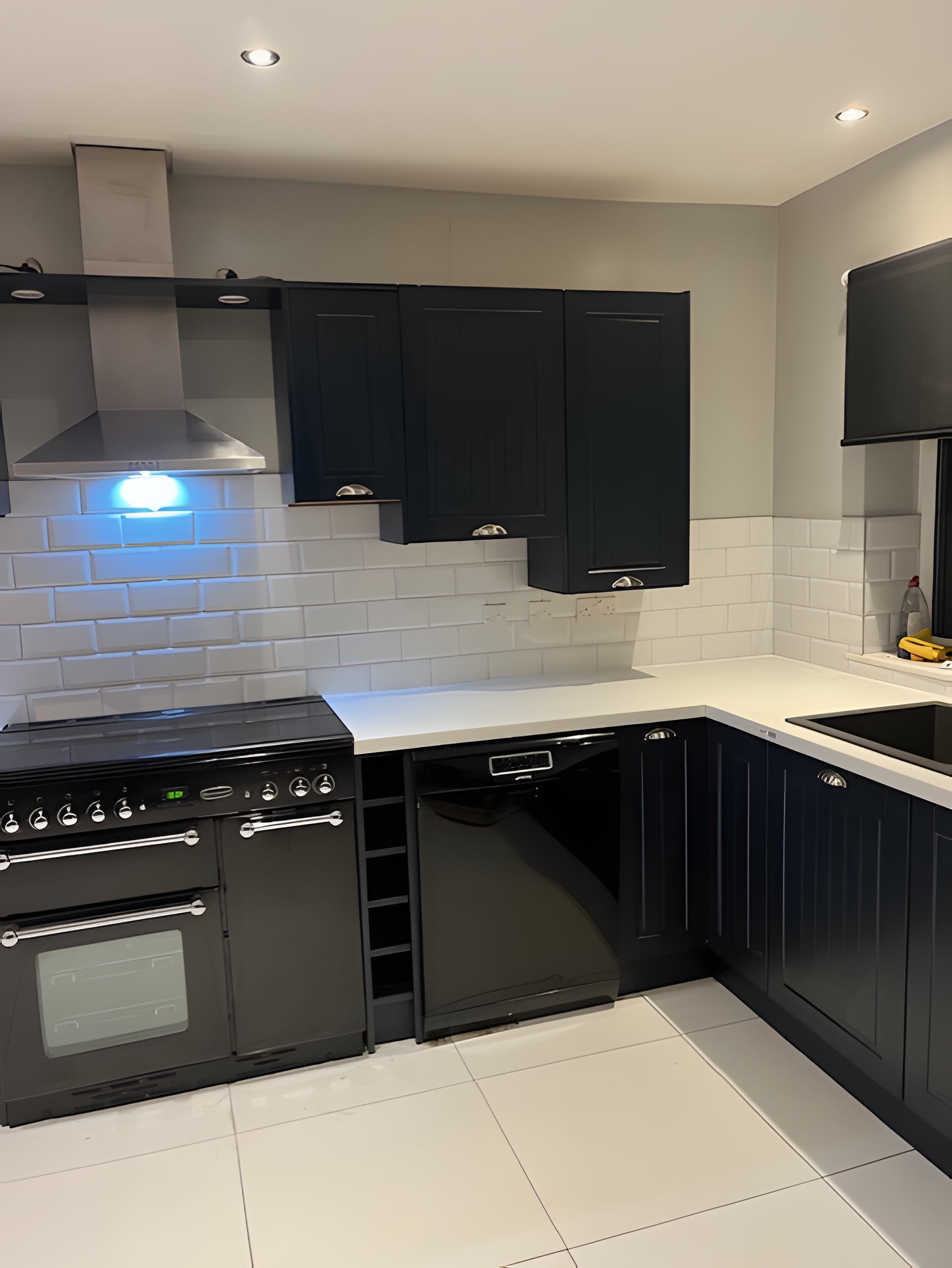 Modern kitchen with Taunton Graphite Matt doors and Bianco Riso Quartz worktops after transformation