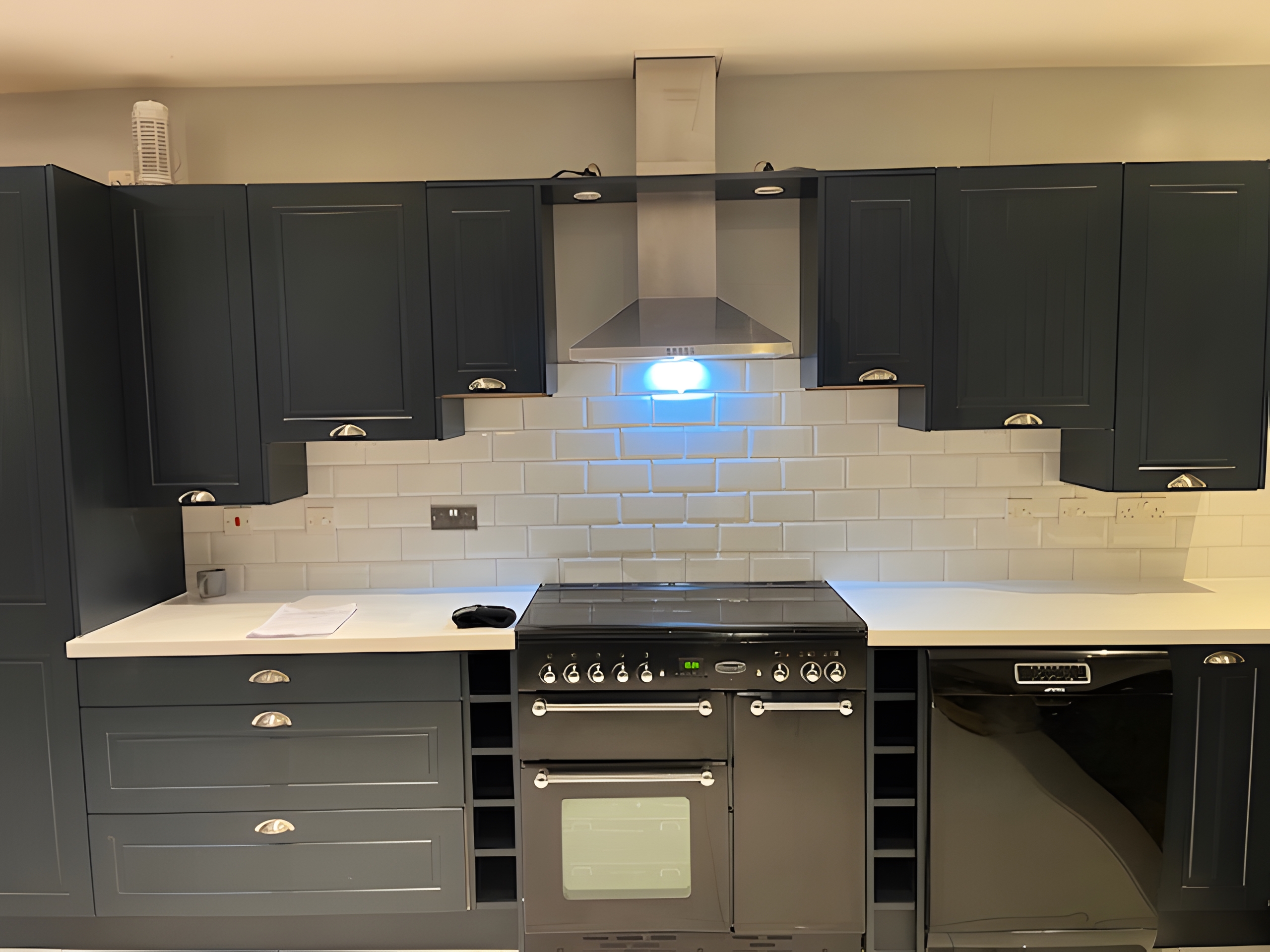 Modern kitchen with Taunton Graphite Matt doors and Bianco Riso Quartz worktops after transformation