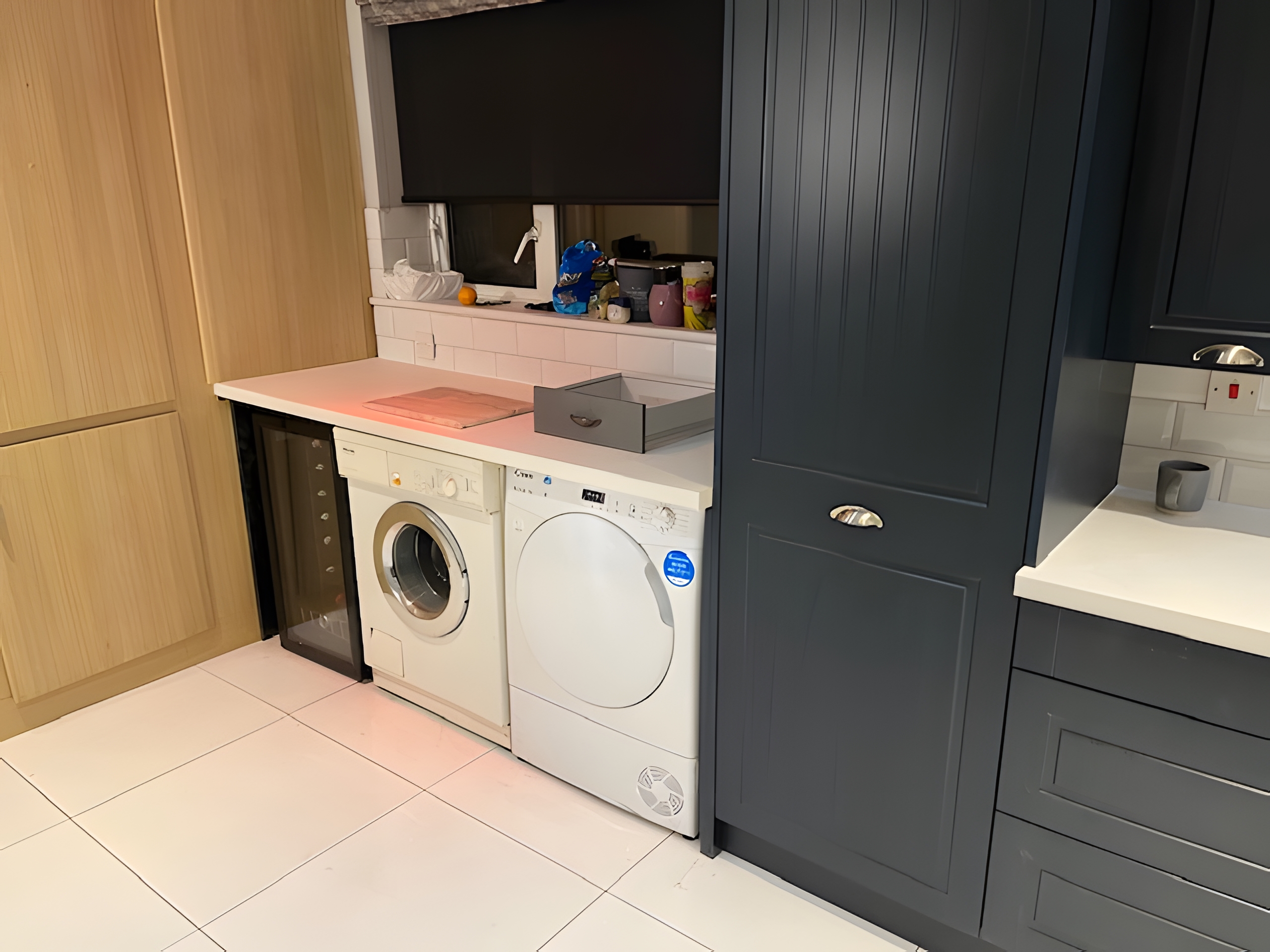 Modern kitchen with Taunton Graphite Matt doors and Bianco Riso Quartz worktops after transformation