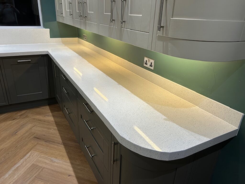 Modern Somerset kitchen with White Sparkle Quartz worktops and grey shaker doors after transformation