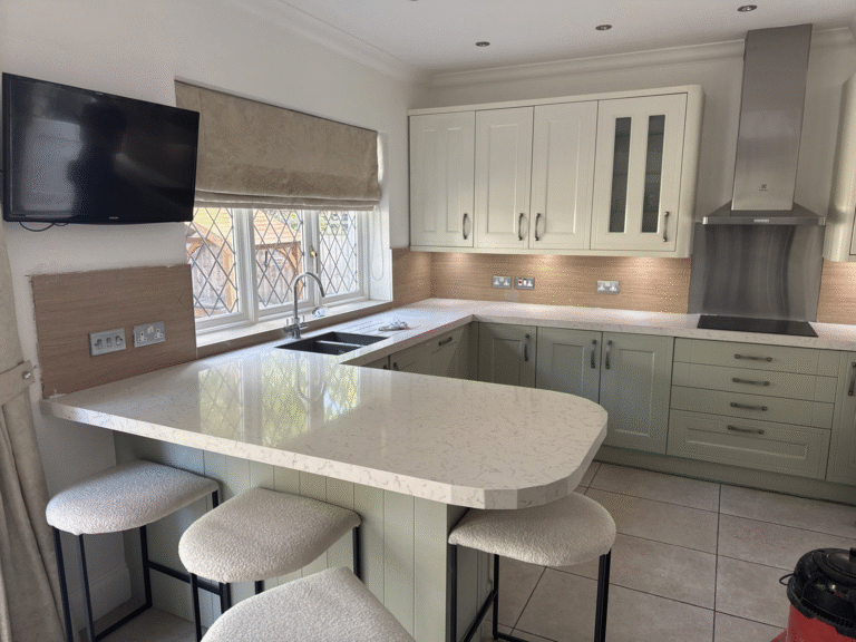 Modern Essex kitchen with Carrara Marble quartz overlay worktops and shaker doors after transformation