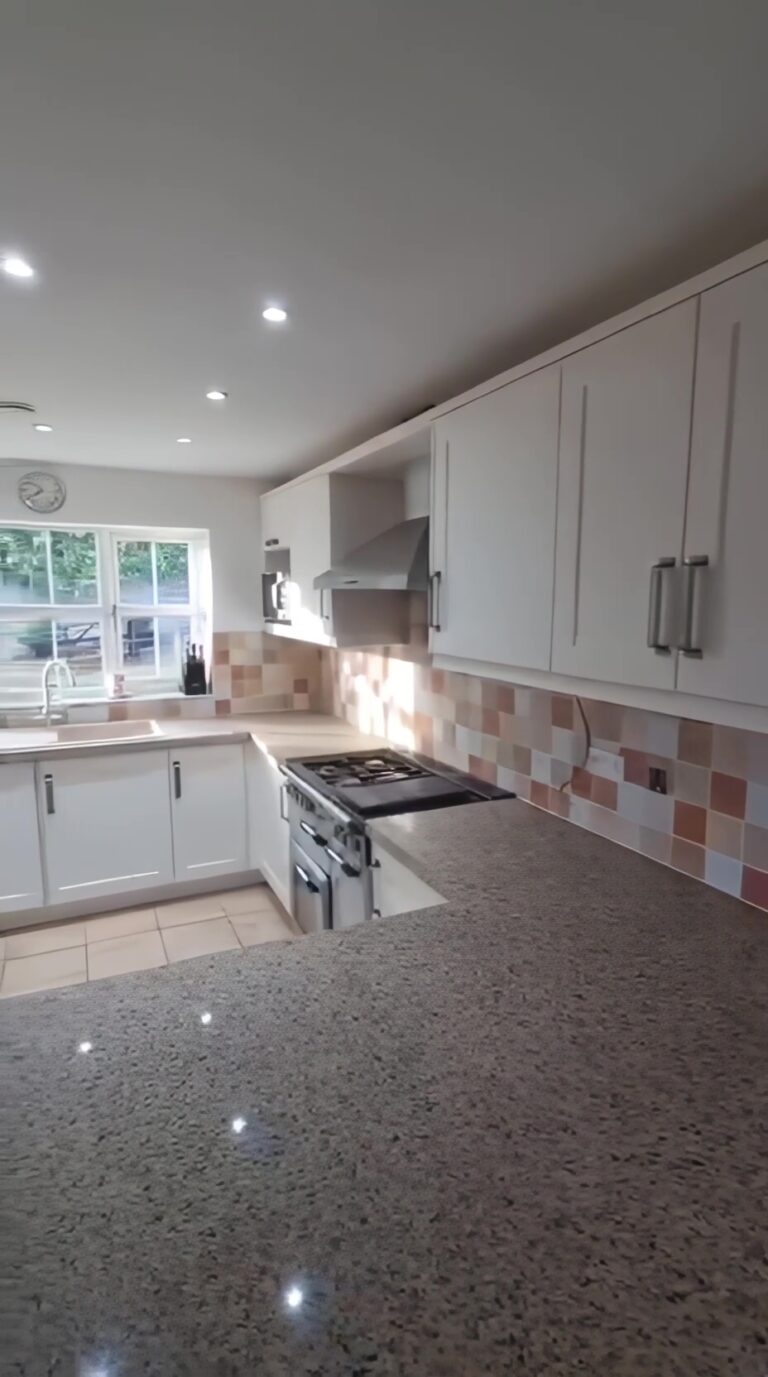 Modern Birmingham kitchen with Horton Matt Ivory shaker doors and Sasso Riso quartz worktops after transformation