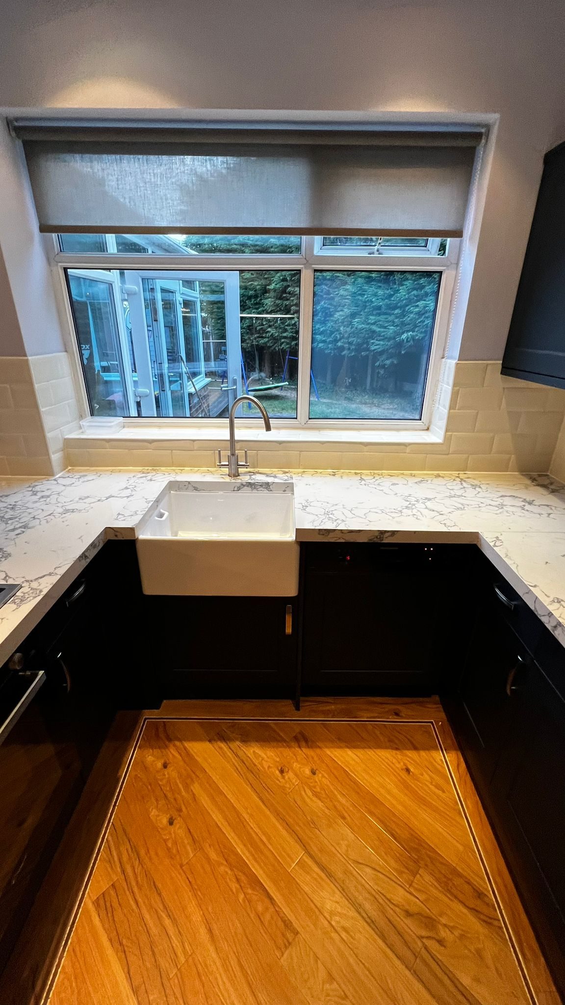 Modern Bolton kitchen with Horton Superior Matt Indigo doors and Bulgaria Dark quartz overlay worktops.