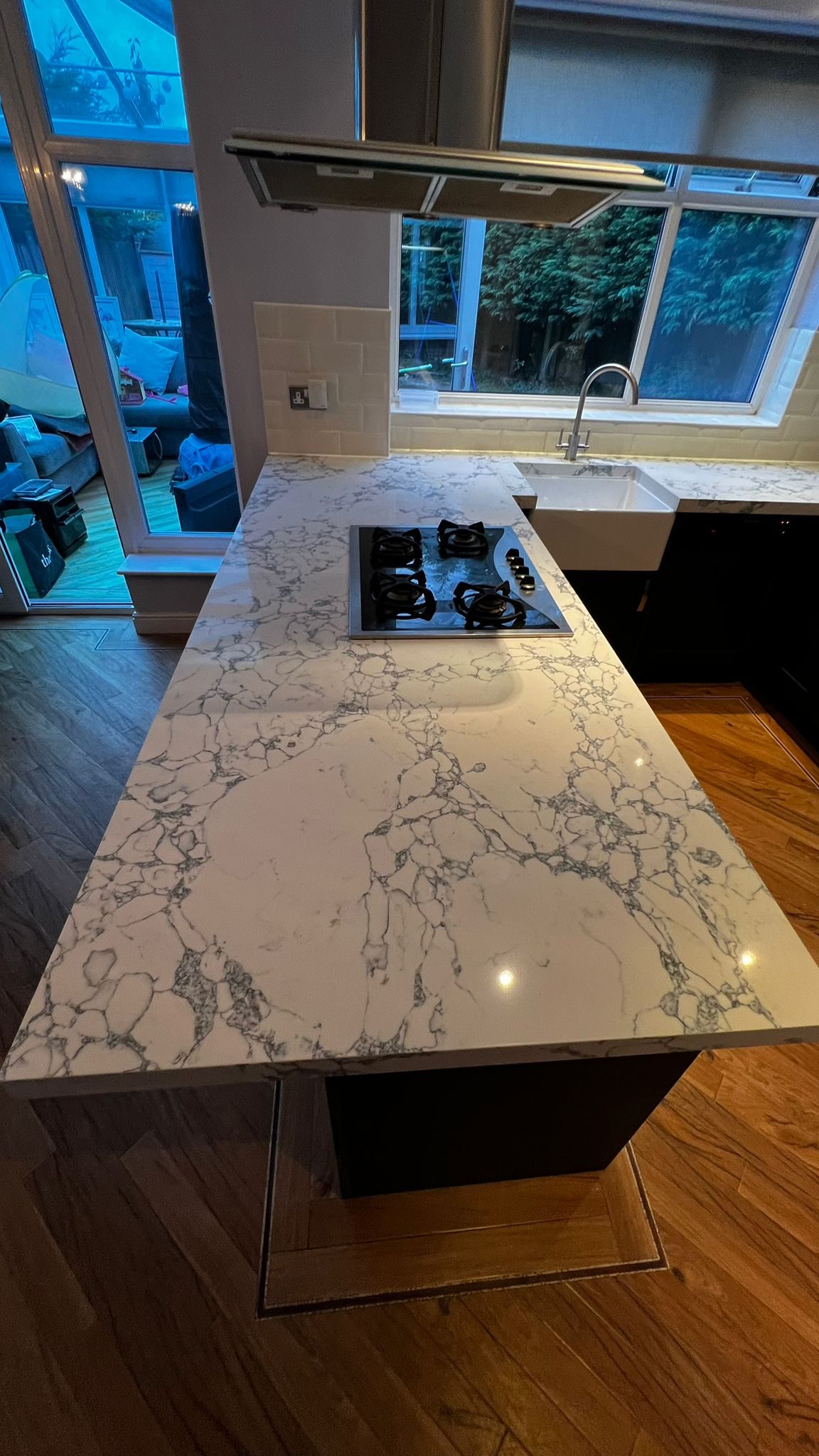 Modern Bolton kitchen with Horton Superior Matt Indigo doors and Bulgaria Dark quartz overlay worktops.