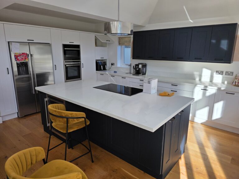 After: Modern Nottingham kitchen with Taunton Shaker doors (Indigo & Porcelain) and Carrara Gold quartz overlay worktops.